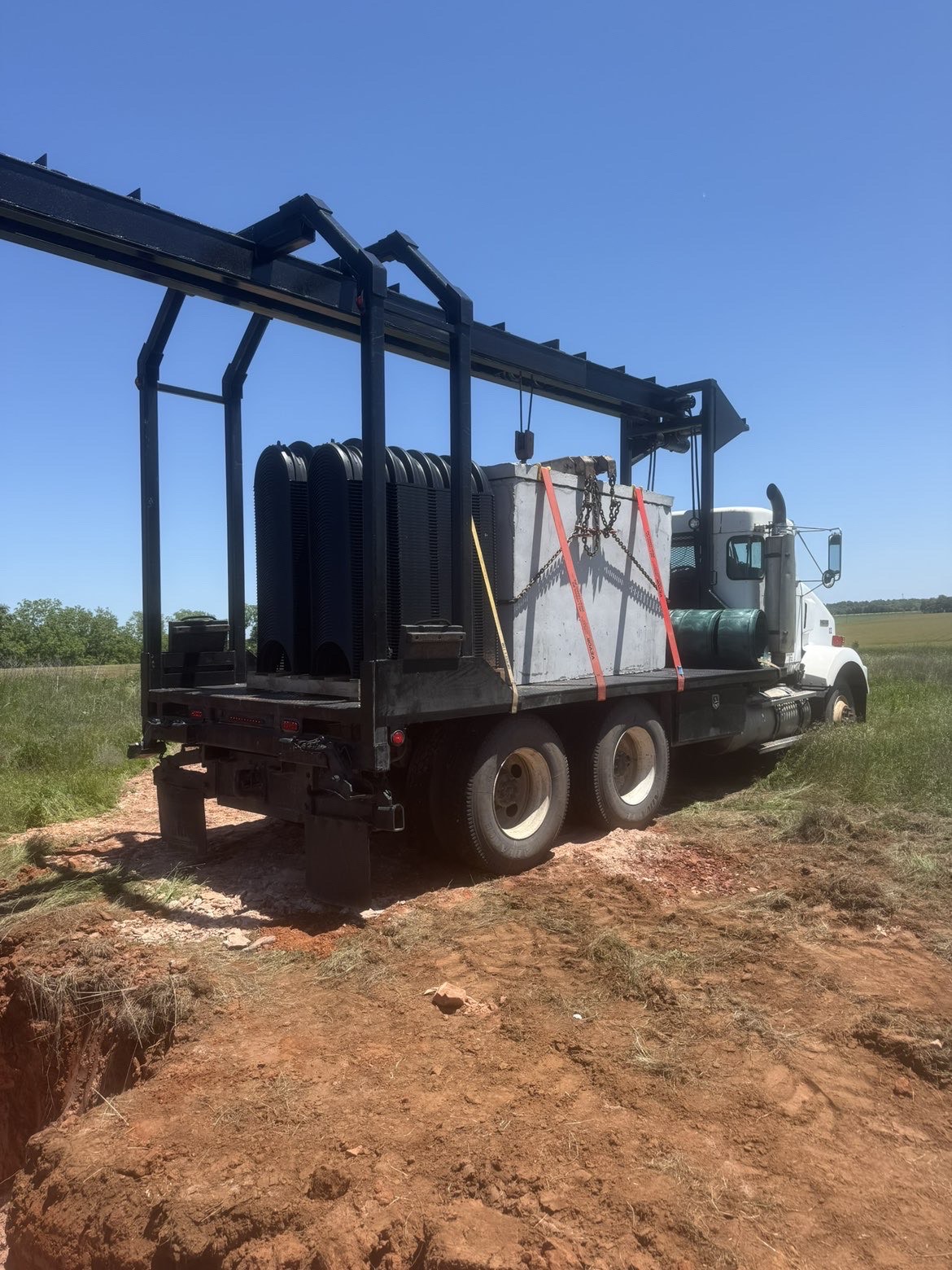 Truck loaded with a concrete septic tank and chambers